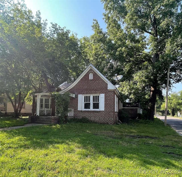 2102 Denver St, Muskogee, OK 74401 - bungalow featuring brick siding and a front lawn