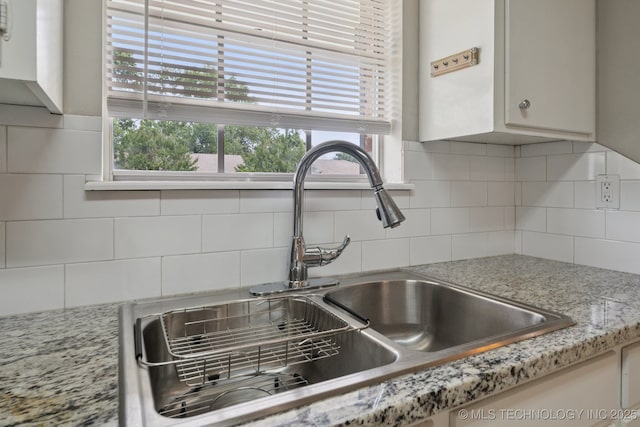 148 E 57th St, Tulsa, OK 74105 - kitchen view of a sink and backsplash