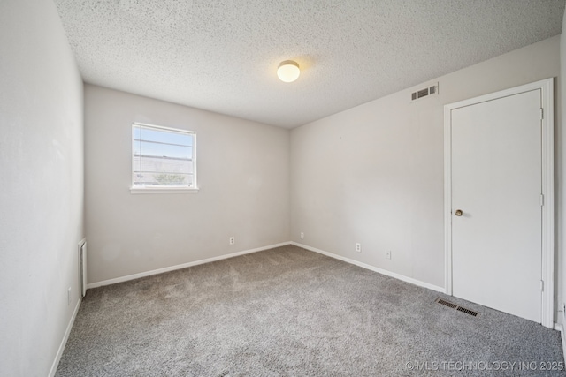148 E 57th St, Tulsa, OK 74105 - carpeted spare room featuring baseboards and a textured ceiling