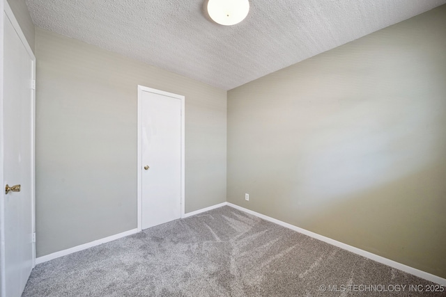 148 E 57th St, Tulsa, OK 74105 - unfurnished bedroom featuring carpet floors and a textured ceiling