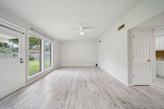 148 E 57th St, Tulsa, OK 74105 - empty room with ceiling fan and light wood finished floors