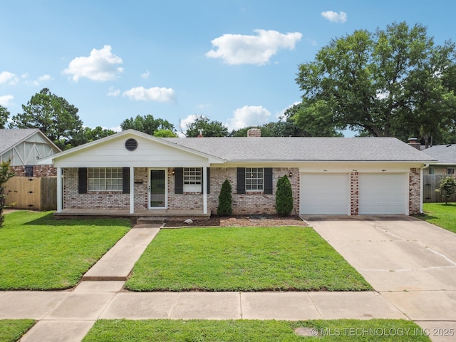 148 E 57th St, Tulsa, OK 74105 - view of front of property featuring brick siding, a garage, driveway, and covered porch