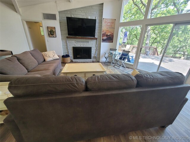 1416 Robin Hood Rd, Eufaula, OK 74432 - living area featuring a fireplace and wood finished floors