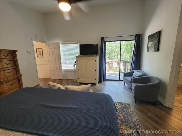 1416 Robin Hood Rd, Eufaula, OK 74432 - bedroom with a towering ceiling, access to outside, multiple windows, wood finished floors, and a ceiling fan