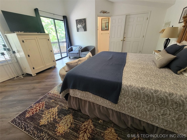 1416 Robin Hood Rd, Eufaula, OK 74432 - bedroom with access to outside and dark wood-style flooring