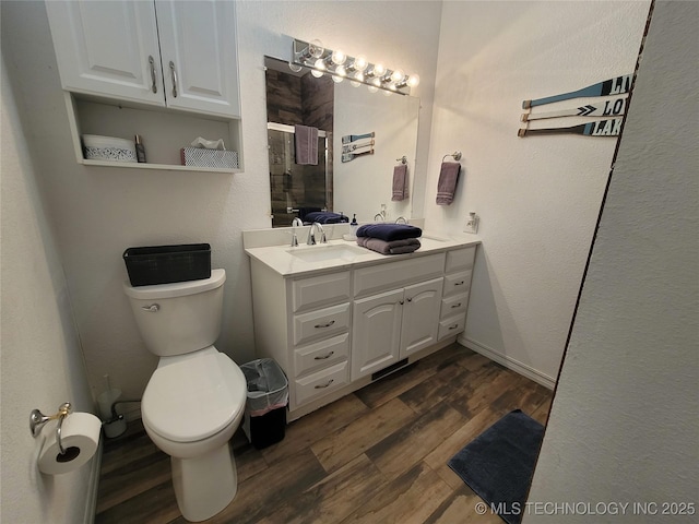 1416 Robin Hood Rd, Eufaula, OK 74432 - full bathroom featuring a shower stall, vanity, and wood finished floors