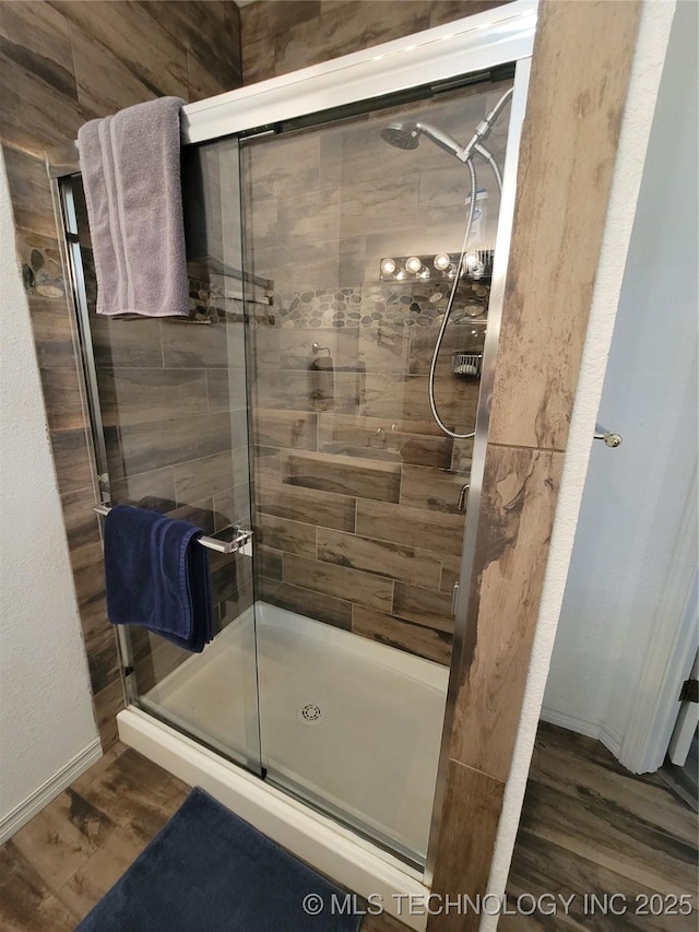1416 Robin Hood Rd, Eufaula, OK 74432 - bathroom with a shower stall and wood finished floors