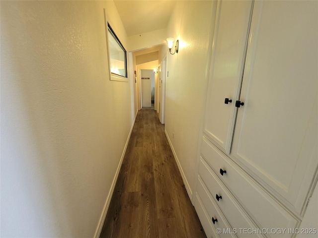 1416 Robin Hood Rd, Eufaula, OK 74432 - hallway featuring dark wood-type flooring and baseboards