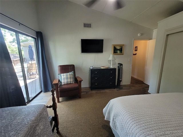 1416 Robin Hood Rd, Eufaula, OK 74432 - bedroom with vaulted ceiling, access to exterior, and wood finished floors