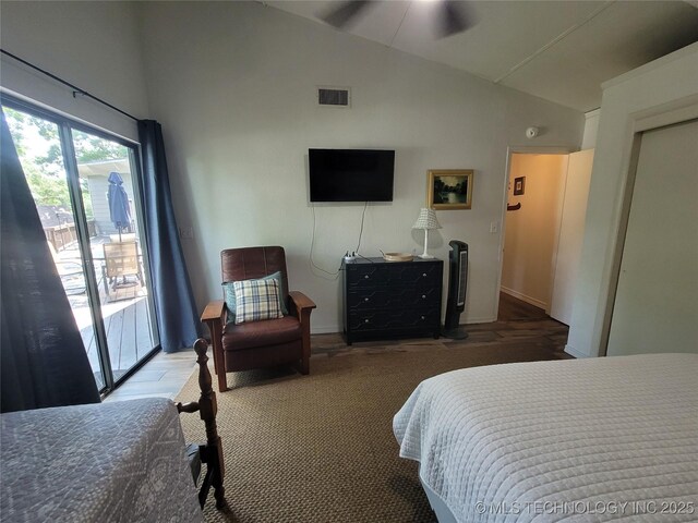 1416 Robin Hood Rd, Eufaula, OK 74432 - bedroom with lofted ceiling, access to exterior, and wood finished floors