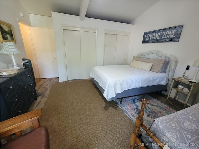 1416 Robin Hood Rd, Eufaula, OK 74432 - bedroom with two closets, wood finished floors, and beamed ceiling