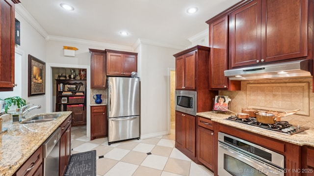 429 Kendall, Muskogee, OK 74401 - kitchen with appliances with stainless steel finishes, under cabinet range hood, crown molding, decorative backsplash, and light stone countertops