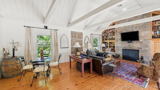 429 Kendall, Muskogee, OK 74401 - living room with wood finished floors, a stone fireplace, and built in shelves