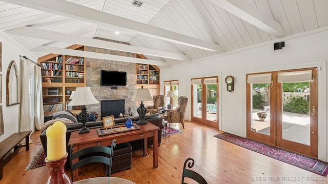 429 Kendall, Muskogee, OK 74401 - living room with plenty of natural light, wood finished floors, french doors, and a stone fireplace