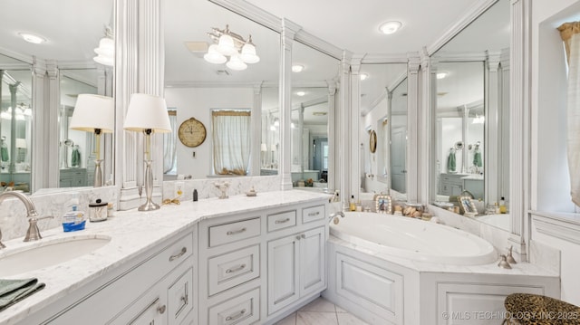 429 Kendall, Muskogee, OK 74401 - bathroom with decorative columns, ornamental molding, a garden tub, and double vanity