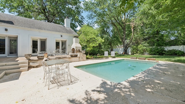 429 Kendall, Muskogee, OK 74401 - view of swimming pool with a patio, exterior kitchen, and a fenced backyard