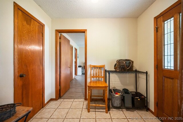 1001 E 1990th Rd, Soper, OK 74759 - hall with a textured ceiling and light tile patterned floors
