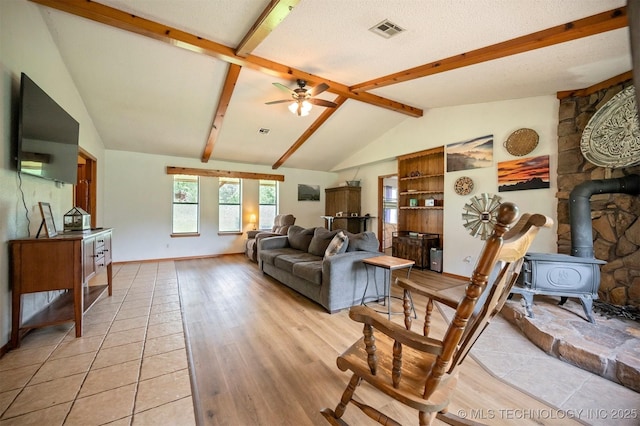 1001 E 1990th Rd, Soper, OK 74759 - living area featuring a wood stove, a ceiling fan, and light wood finished floors