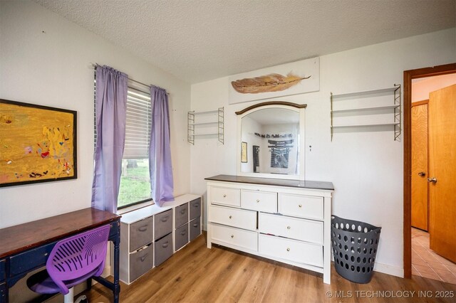 1001 E 1990th Rd, Soper, OK 74759 - office space featuring wood finished floors and a textured ceiling