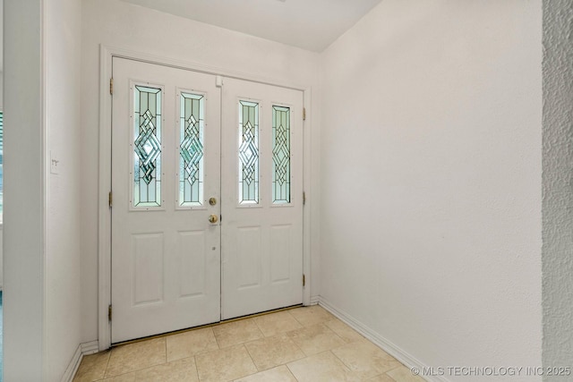 6725 E 51st Pl S, Tulsa, OK 74145 - entryway featuring baseboards and light tile patterned floors