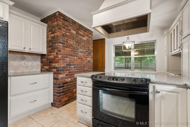 6725 E 51st Pl S, Tulsa, OK 74145 - kitchen featuring black / electric stove, light tile patterned floors, light stone counters, backsplash, and a chandelier