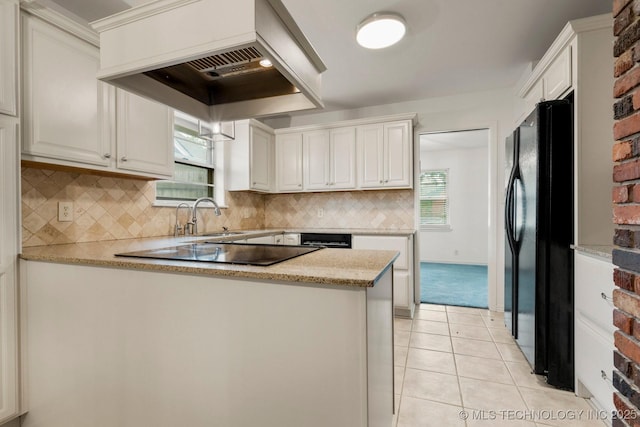 6725 E 51st Pl S, Tulsa, OK 74145 - kitchen featuring black appliances, custom exhaust hood, a peninsula, light tile patterned floors, and decorative backsplash