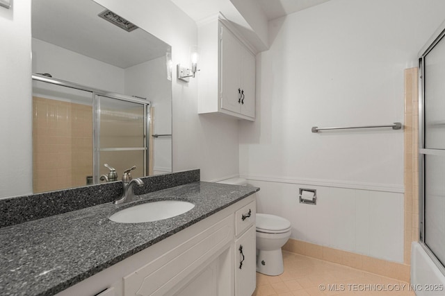 6725 E 51st Pl S, Tulsa, OK 74145 - bathroom with a shower with shower door, vanity, wainscoting, and tile patterned floors