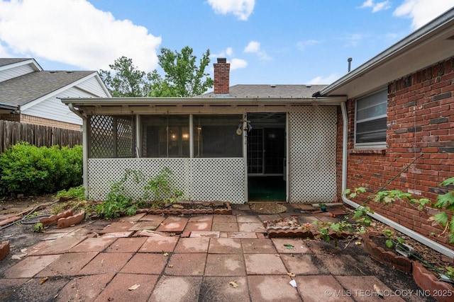 6725 E 51st Pl S, Tulsa, OK 74145 - view of patio / terrace featuring a sunroom
