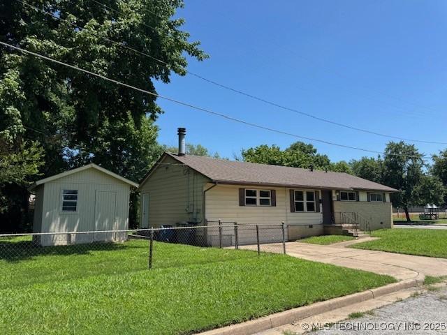 4307 W Reconciliation Way, Tulsa, OK 74127 - ranch-style house with a storage unit and driveway