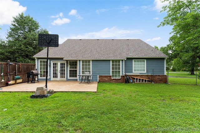 704 NE 3rd St, Wagoner, OK 74467 - rear view of property with french doors, a patio, a shingled roof, and a fenced backyard