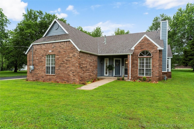 704 NE 3rd St, Wagoner, OK 74467 - view of front of house with brick siding, a chimney, and roof with shingles