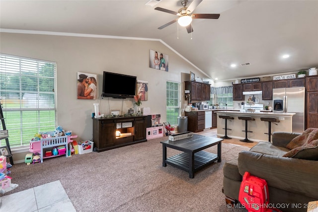 704 NE 3rd St, Wagoner, OK 74467 - living room with a ceiling fan, lofted ceiling, healthy amount of natural light, ornamental molding, and recessed lighting