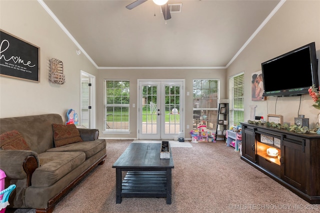 704 NE 3rd St, Wagoner, OK 74467 - living area featuring lofted ceiling, crown molding, carpet, ceiling fan, and french doors
