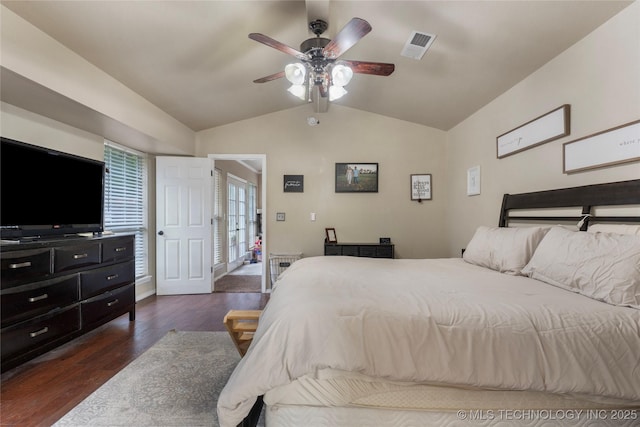 704 NE 3rd St, Wagoner, OK 74467 - bedroom with vaulted ceiling, dark wood-style flooring, and ceiling fan