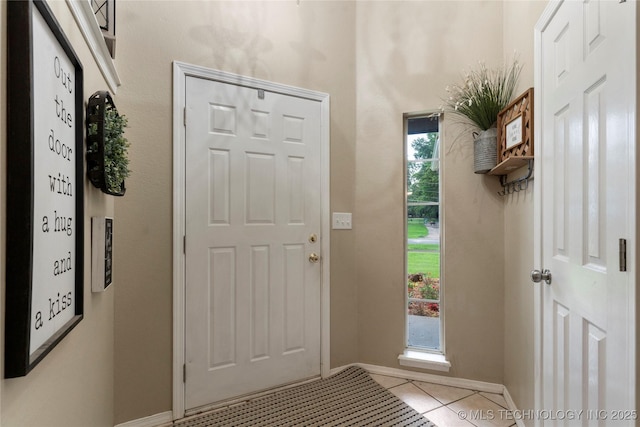 704 NE 3rd St, Wagoner, OK 74467 - entrance foyer with tile patterned flooring and baseboards