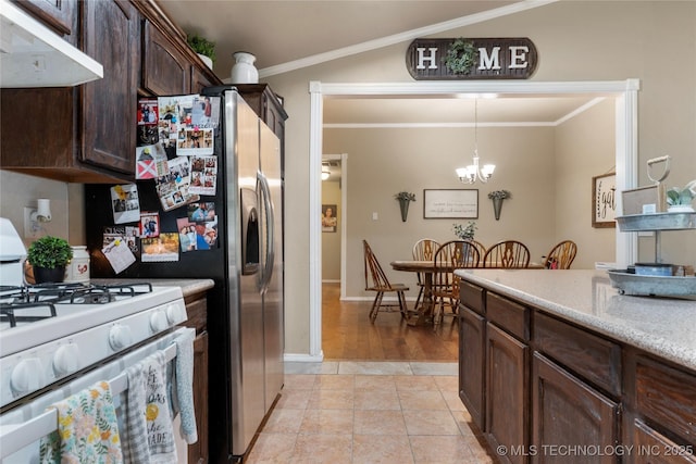 704 NE 3rd St, Wagoner, OK 74467 - kitchen with white range with gas stovetop, under cabinet range hood, dark brown cabinetry, crown molding, and a chandelier
