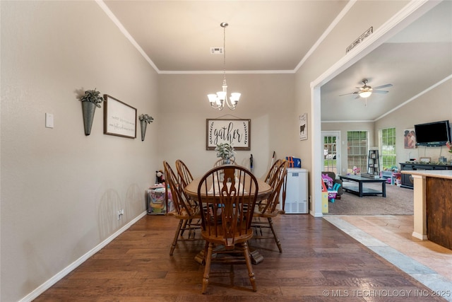 704 NE 3rd St, Wagoner, OK 74467 - dining room featuring wood finished floors, a ceiling fan, a chandelier, and crown molding
