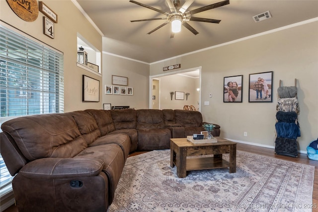 704 NE 3rd St, Wagoner, OK 74467 - living area with ceiling fan, wood finished floors, and ornamental molding