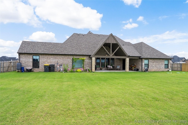 17831 S 46th E Ave, Bixby, OK 74008 - rear view of property featuring brick siding, a fenced backyard, a shingled roof, and a patio