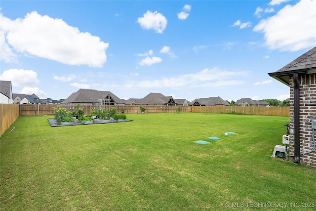 17831 S 46th E Ave, Bixby, OK 74008 - fenced backyard with a vegetable garden and a residential view