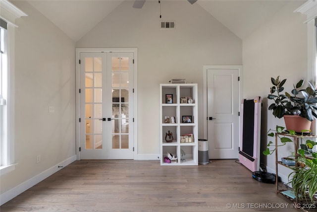 17831 S 46th E Ave, Bixby, OK 74008 - empty room with french doors, ceiling fan, wood finished floors, and high vaulted ceiling