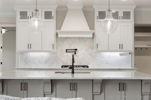 17831 S 46th E Ave, Bixby, OK 74008 - kitchen with premium range hood, backsplash, crown molding, and white cabinets