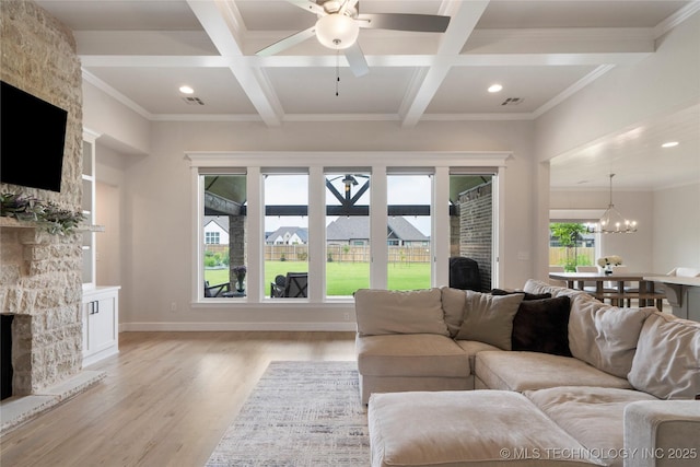 17831 S 46th E Ave, Bixby, OK 74008 - living room with a stone fireplace, a ceiling fan, coffered ceiling, light wood-style flooring, and beam ceiling