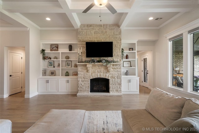17831 S 46th E Ave, Bixby, OK 74008 - living area featuring a stone fireplace, a ceiling fan, wood finished floors, coffered ceiling, and beamed ceiling