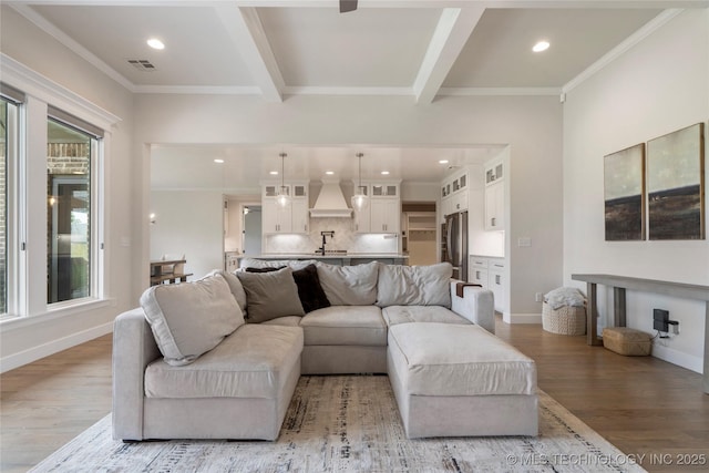 17831 S 46th E Ave, Bixby, OK 74008 - living room featuring wood finished floors, crown molding, recessed lighting, and beam ceiling