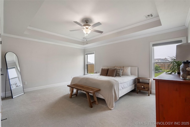 17831 S 46th E Ave, Bixby, OK 74008 - bedroom featuring a raised ceiling, multiple windows, and ornamental molding