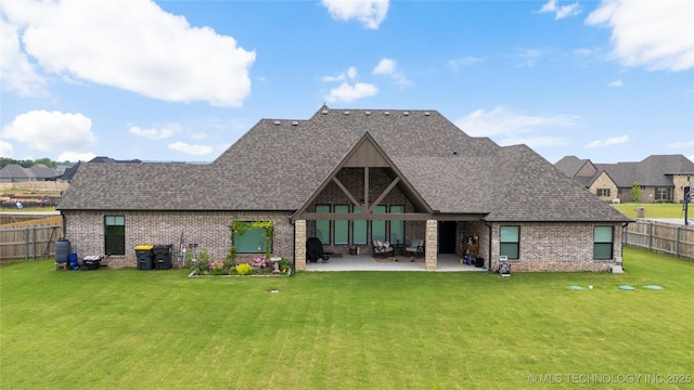 17831 S 46th E Ave, Bixby, OK 74008 - back of house featuring a fenced backyard, roof with shingles, a patio, and brick siding