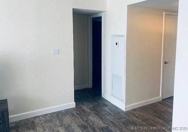 410 W 7th St Unit 229, Tulsa, OK 74119 - unfurnished room featuring wood finished floors and baseboards