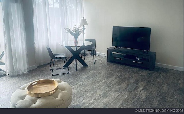 410 W 7th St Unit 229, Tulsa, OK 74119 - dining space featuring wood finished floors and baseboards