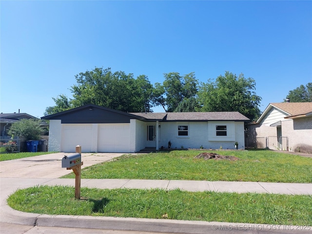 12623 E 19th St, Tulsa, OK 74128 - ranch-style house with an attached garage, driveway, and brick siding